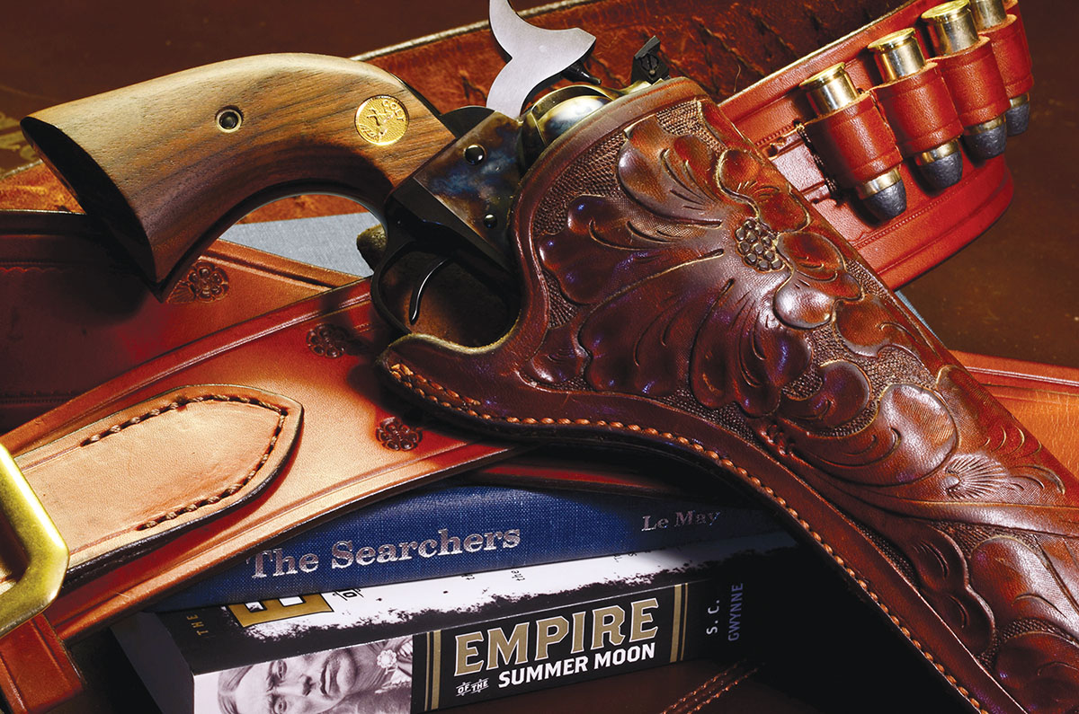Old guns, old leather and the Old West go together like peaches and cream in the imaginations of American afiçionados. The revolver is a Colt New Frontier, the holster by George Lawrence of Oregon.